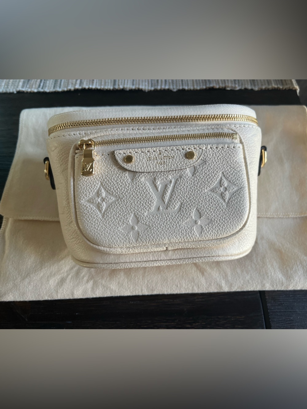 Louis Vuitton Mini Bumbag  
Cream empreinte leather with Gold Hardware
